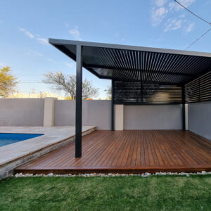 Black Pergola installed near the pool with wooden floor